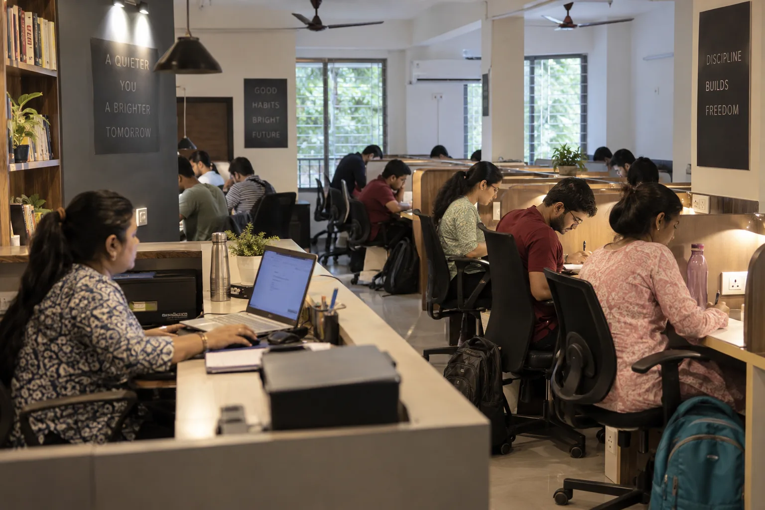 Study library staff using Libix with adult learners in a Kolkata paid reading room