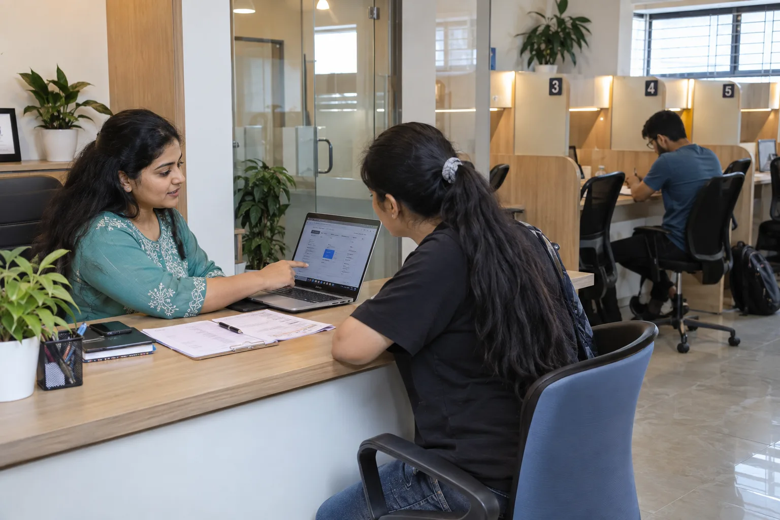 Indian study-library receptionist enrolling an adult member and reviewing a membership plan