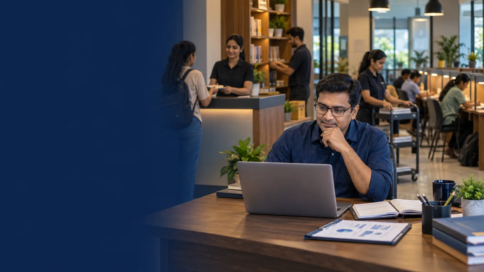 Indian study library owner reviewing operations in Libix Library OS while trained staff manage routine work